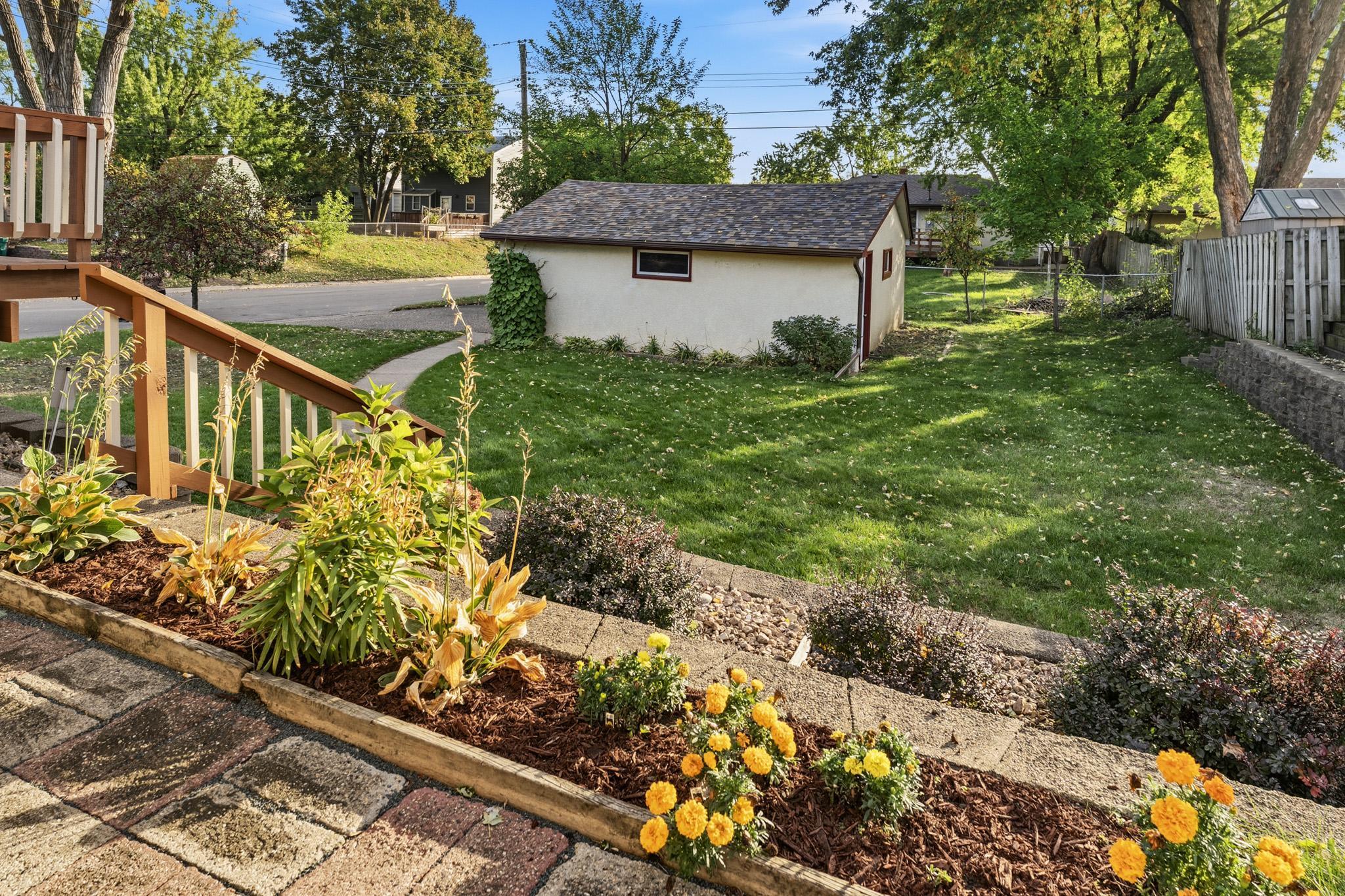Nice landscaping and large back yard perfect for gardening, kids and pets