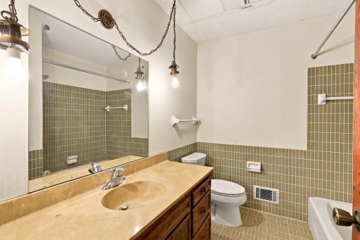 Guest full bathroom serves the additional bedrooms and household needs.