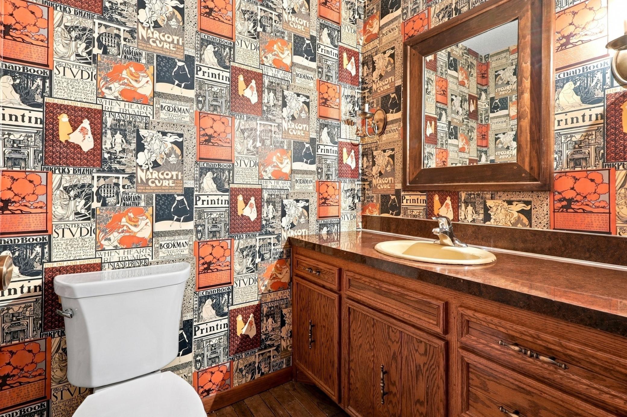 Convenient main-floor half bath adds functionality for everyday living and guests.