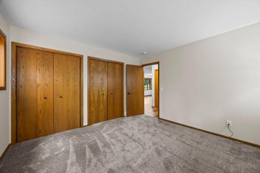 Bedroom 2 features fresh carpet and a fresh coat of paint that includes plenty of closet space.