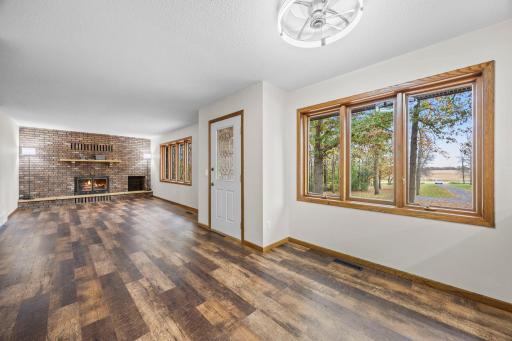 Fresh paint and new flooring throughout give the home a bright, updated feel, while abundant windows fill the space with natural light.