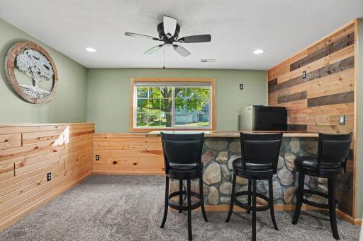 Knotty pine & wood walls w/stone accents