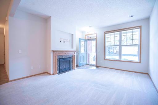 Living Room with gas fireplace right off front entry