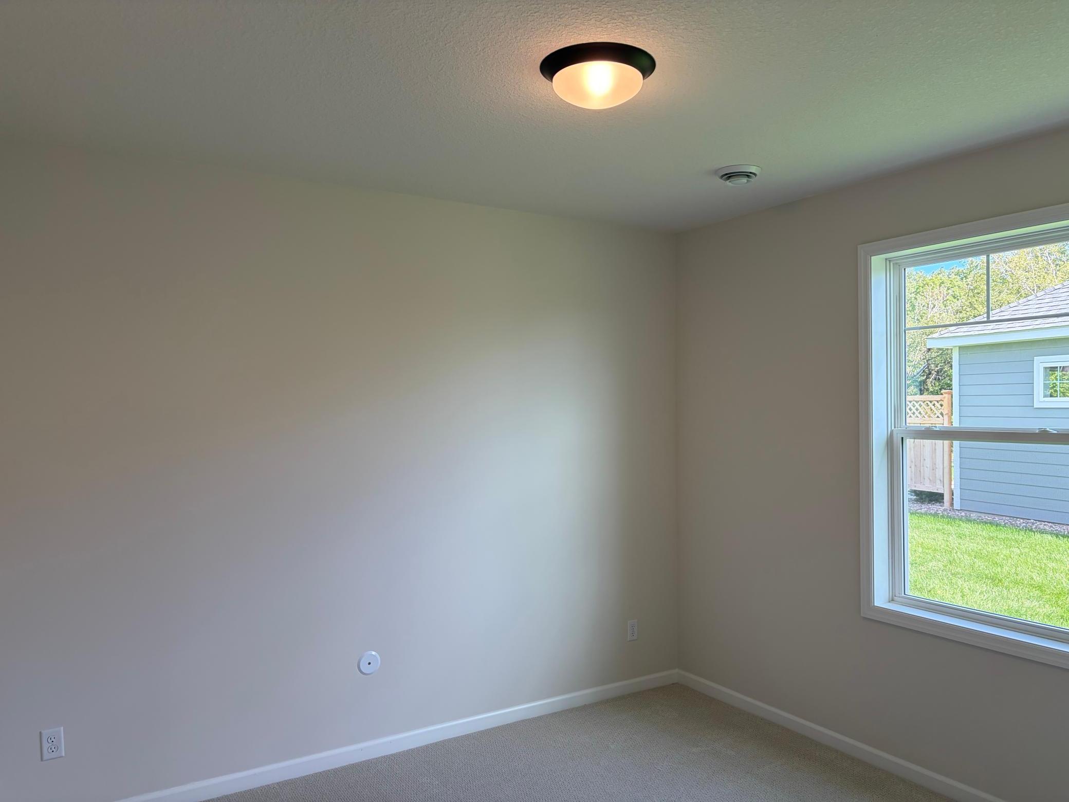 The secondary bedroom is perfectly sized for any use.