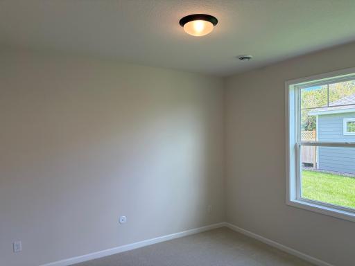 The secondary bedroom is perfectly sized for any use.