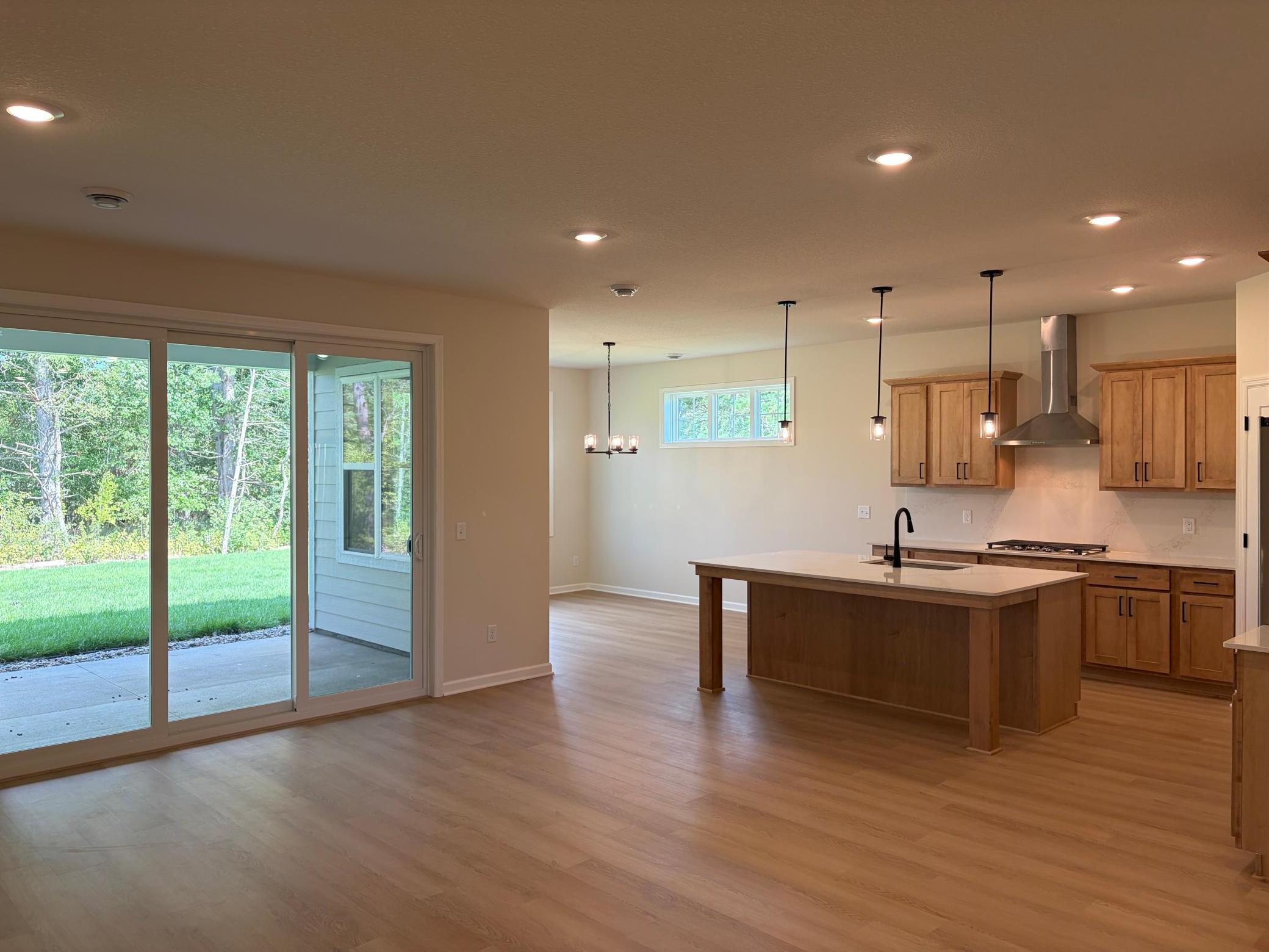 A reverse look showing how the living, kitchen, and dining room all come together.