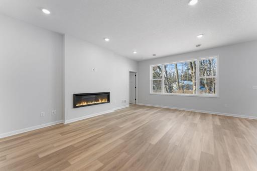Family Room -similar home- LVP flooring, huge window brings in tons of light!