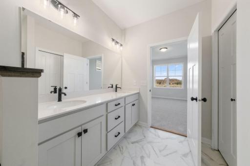 Owner's Bathroom features dual sinks and extra counter space! similar home, representational photo