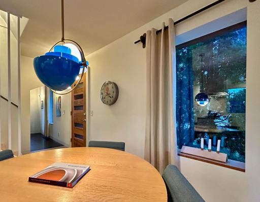 Dining area w/ front entry door. The door is also a masterpiece.