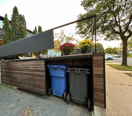 Notice yet MORE impressive details. The sliding door hides the garbage/recycling cubby.