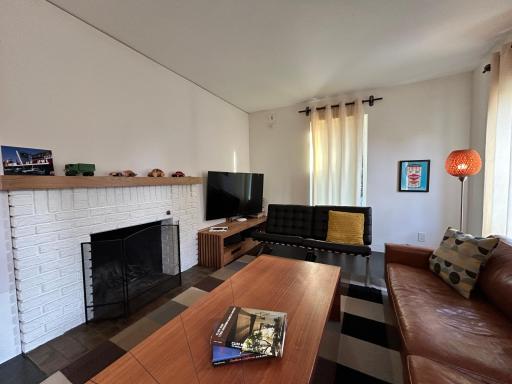Beautiful Rumford style brick fireplace is definitely a focal point.