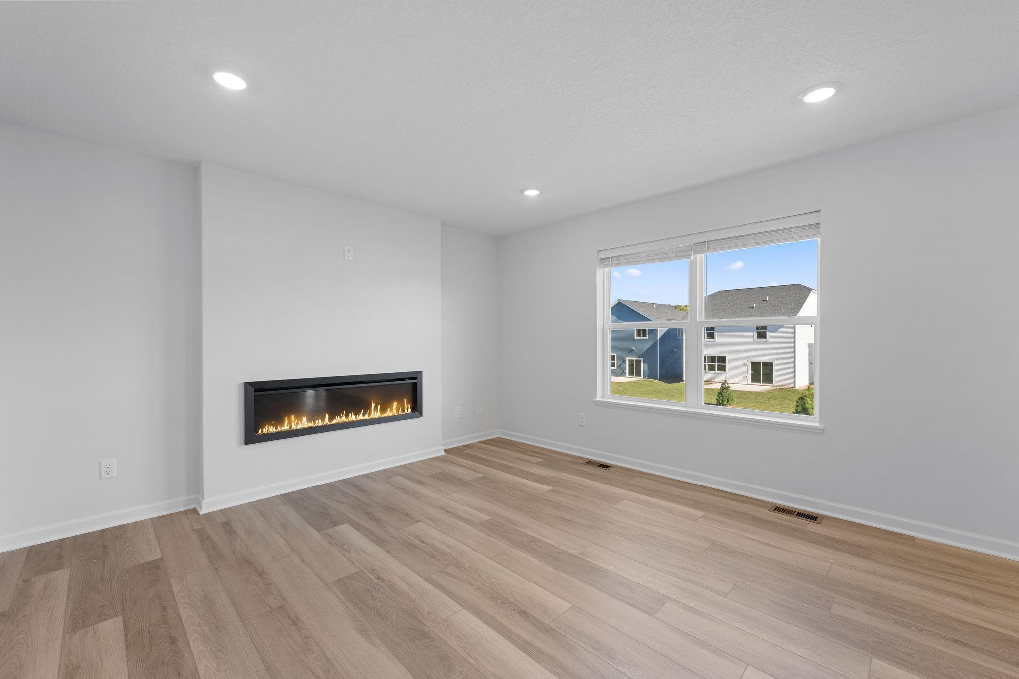 Family room with electric fireplace - Picture of Model Home