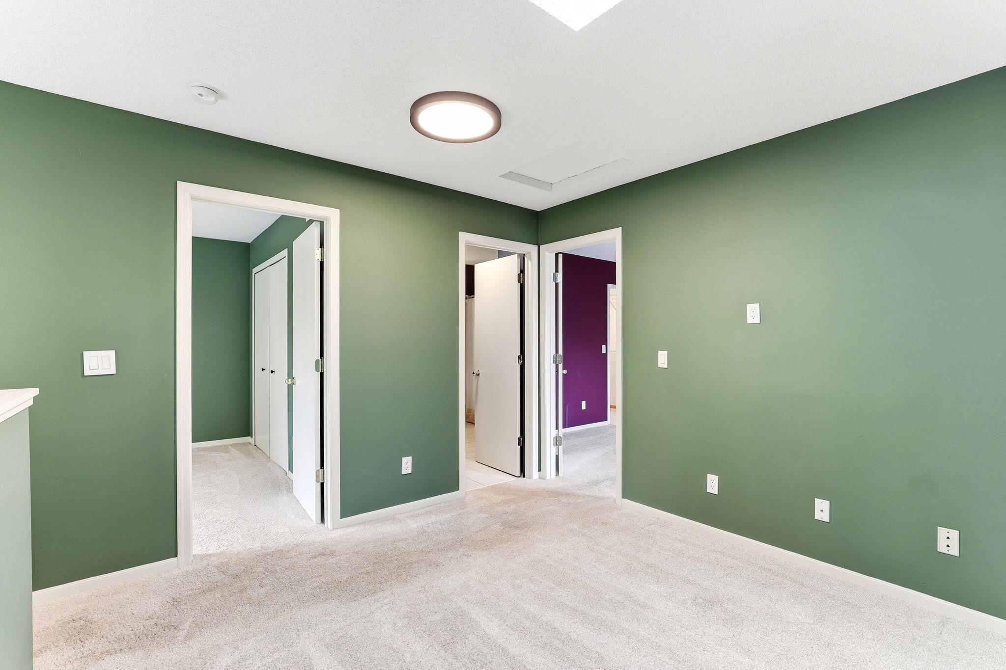 The upper landing offers a seamless flow, connecting the flexible loft space to two spacious bedrooms and a full bathroom, ensuring privacy and convenience for the upper level.