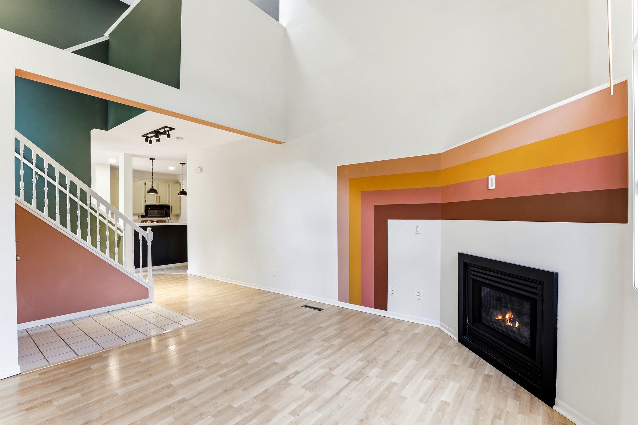 The layout flows effortlessly from the living room to the dining area. High ceilings and professionally painted walls create an airy, spacious feel, perfect for modern living and entertaining.