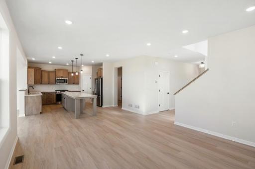 A wider-angle view showcases the full extent of the kitchen space. *Model home photos, colors and selections may vary.*
