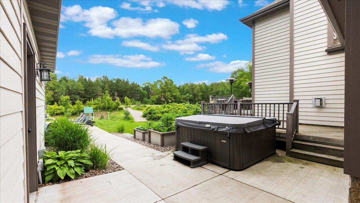 Hot tub off the wraparound deck for your enjoyment.