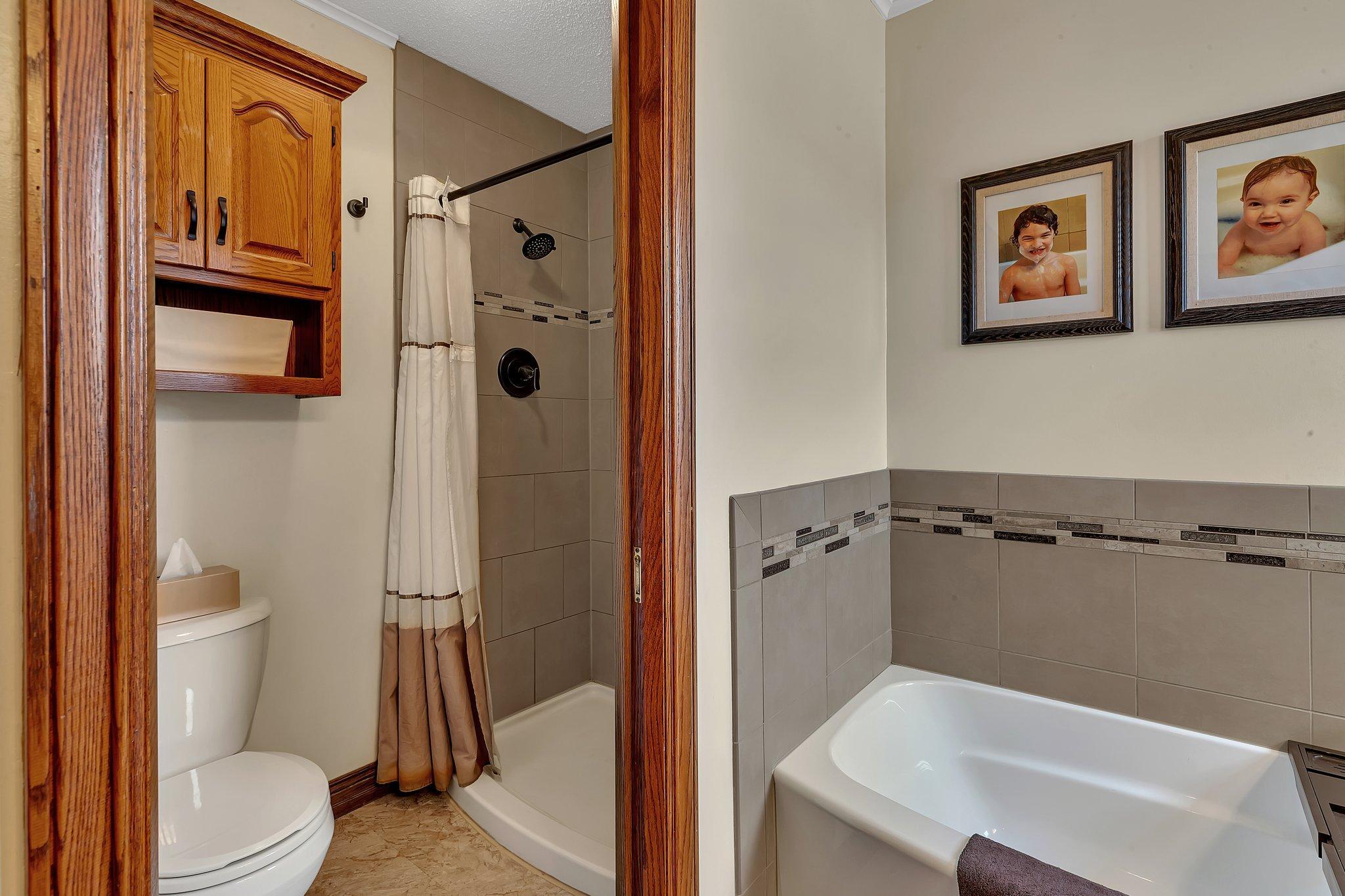 Primary shower & bath tub.