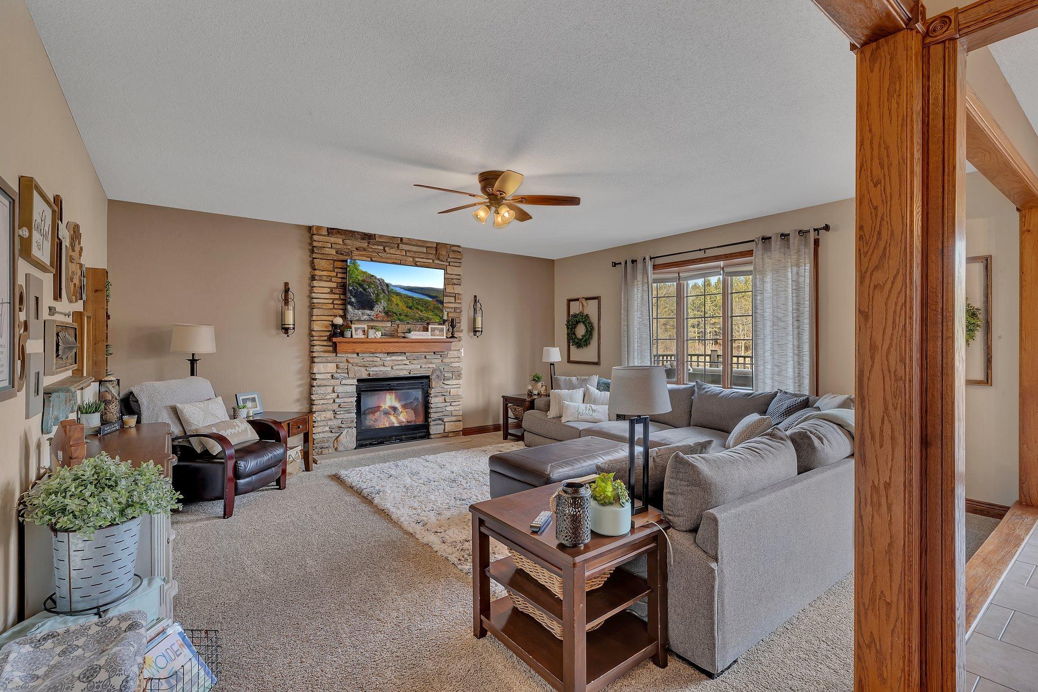 Main floor living room with gas fireplace and gorgeously updated surround.