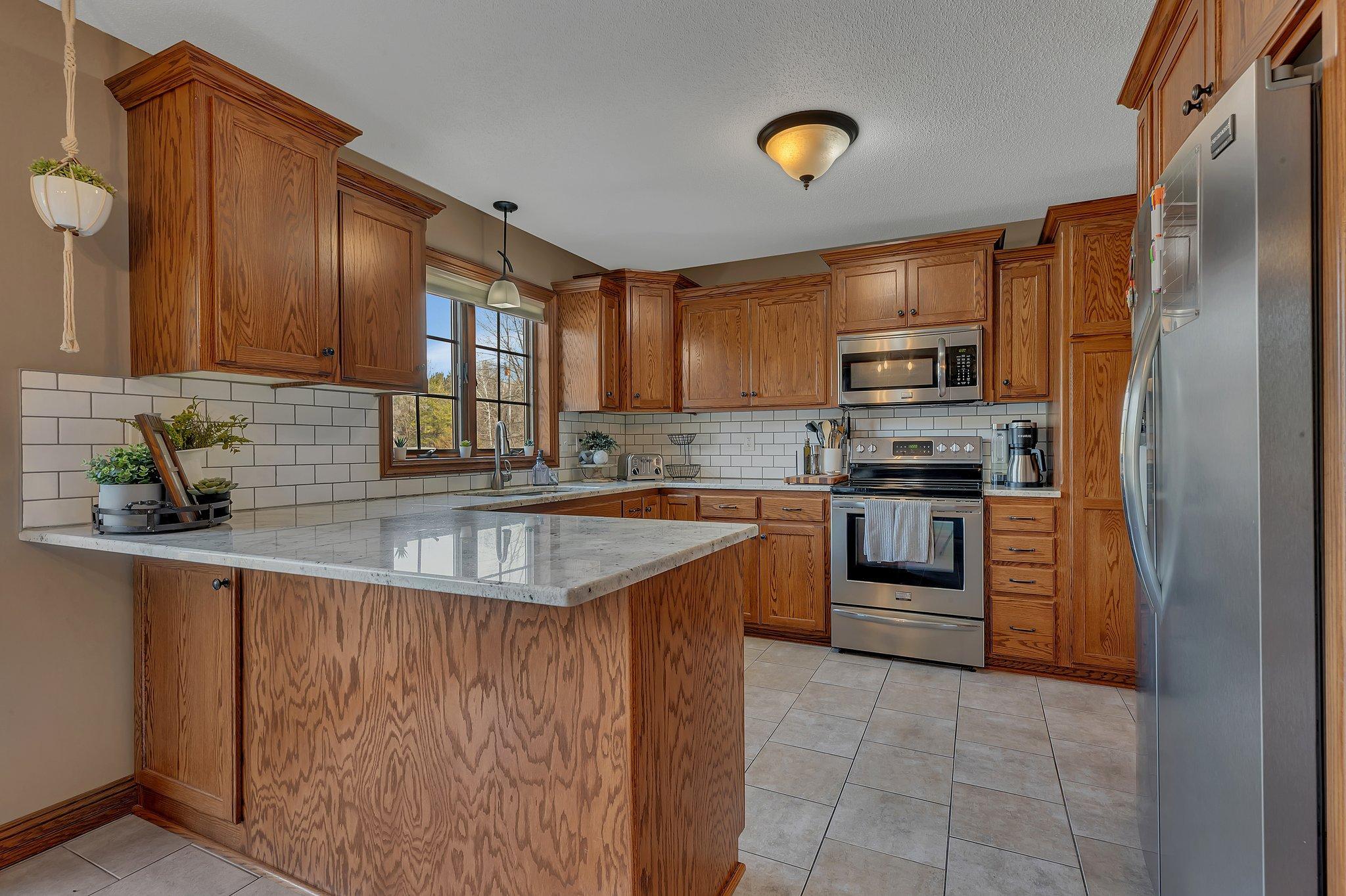Timeless custom cabinets tuck in the beautifully renovated kitchen.