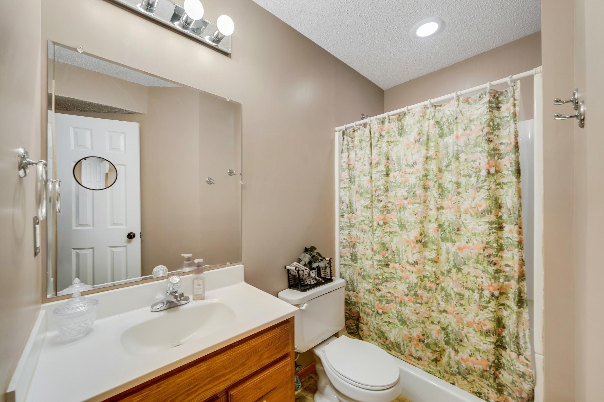 Lower level bathroom has a large shower.