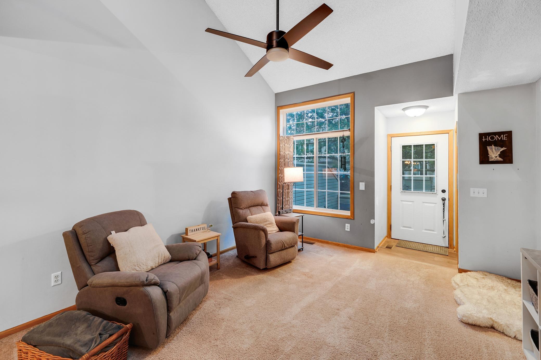 As you walk in, you are greeted by high ceilings, a skylight, and an open loft.