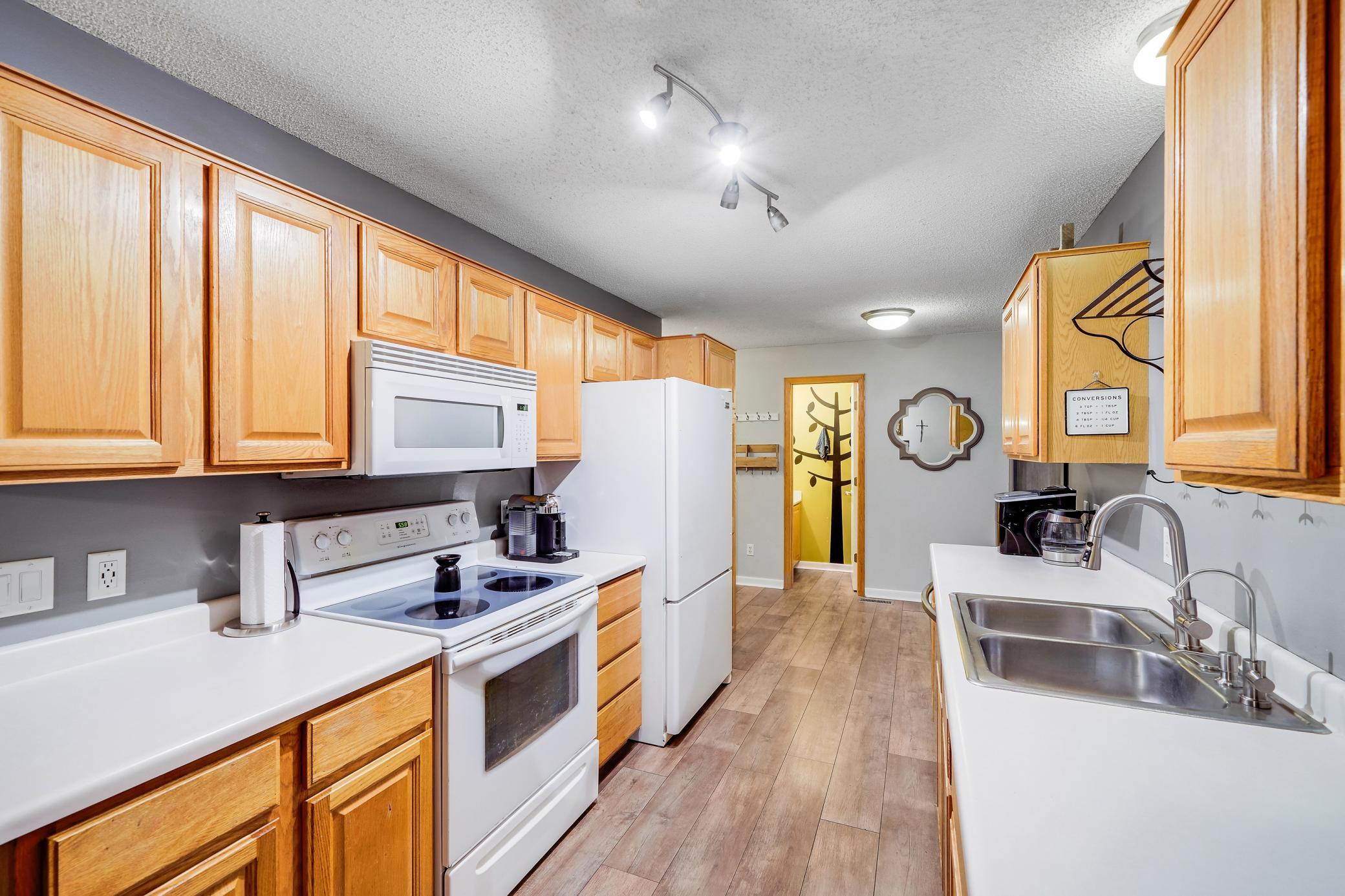 Enter the kitchen from the garage.