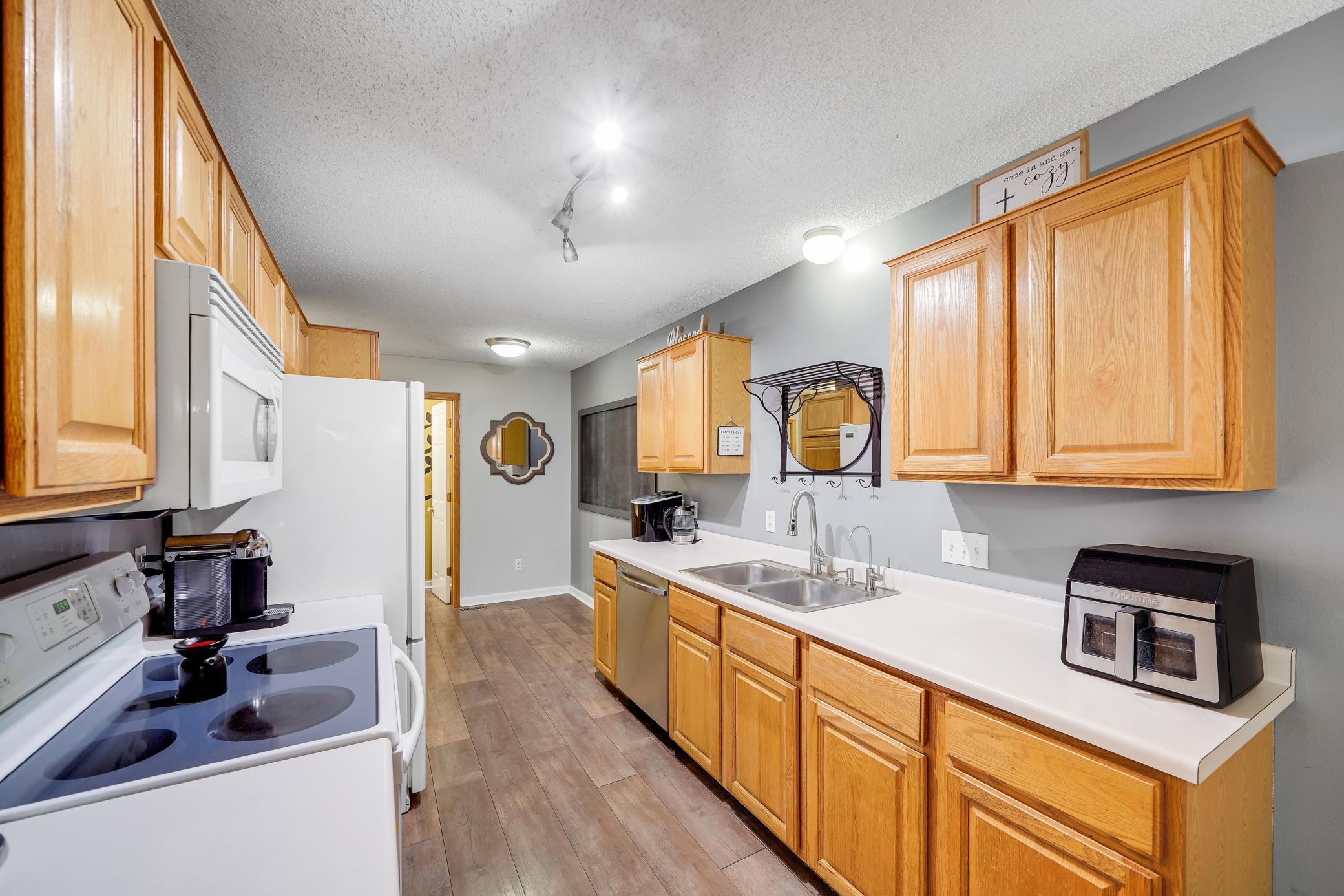 The galley kitchen has room on the end for extra eat-in area or a home office.