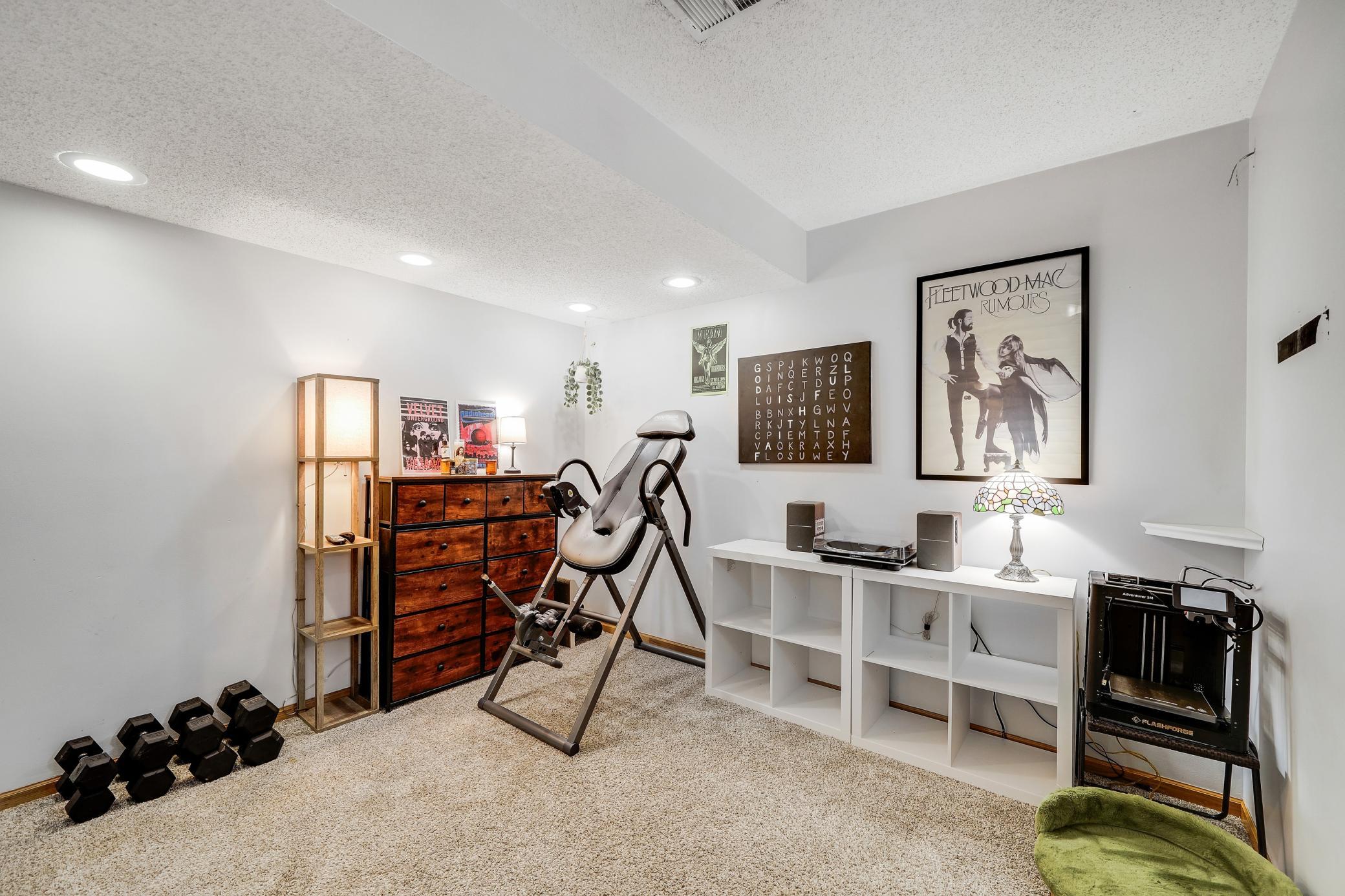 The family room is on the lower level, and has bright recessed lighting.