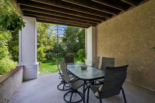 Covered patio is accessed from the lower level family room. Perfect for hanging out, casual dining and just steps to the backyard. In addition, the area is wired for a future hot tub.