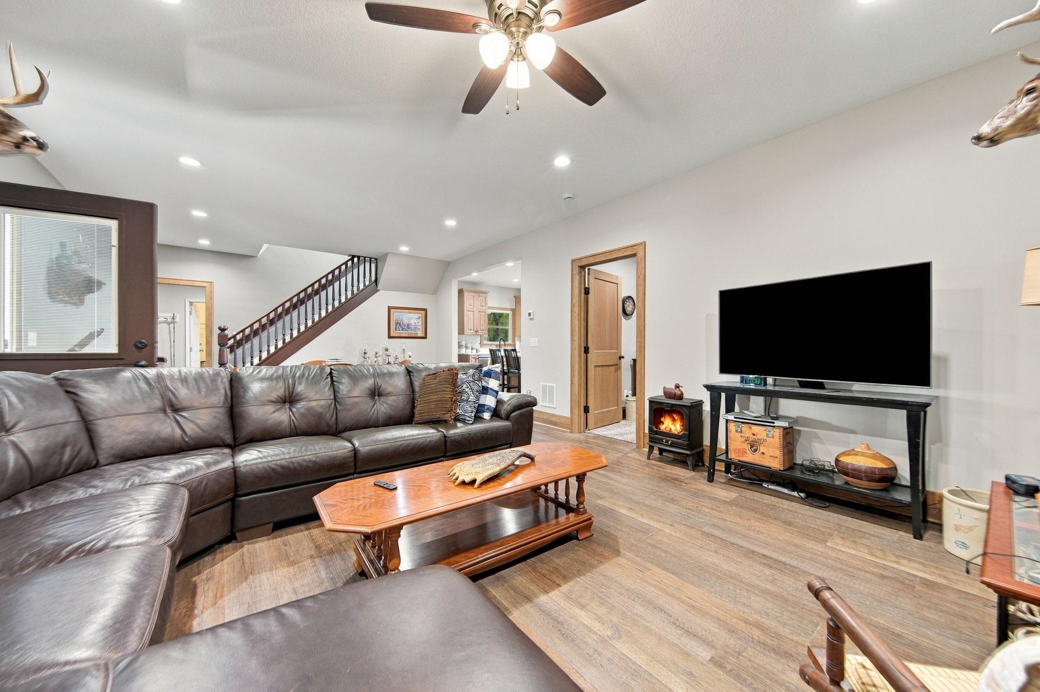 Main floor living room with fresh flooring throughout, new trim, and doors!
