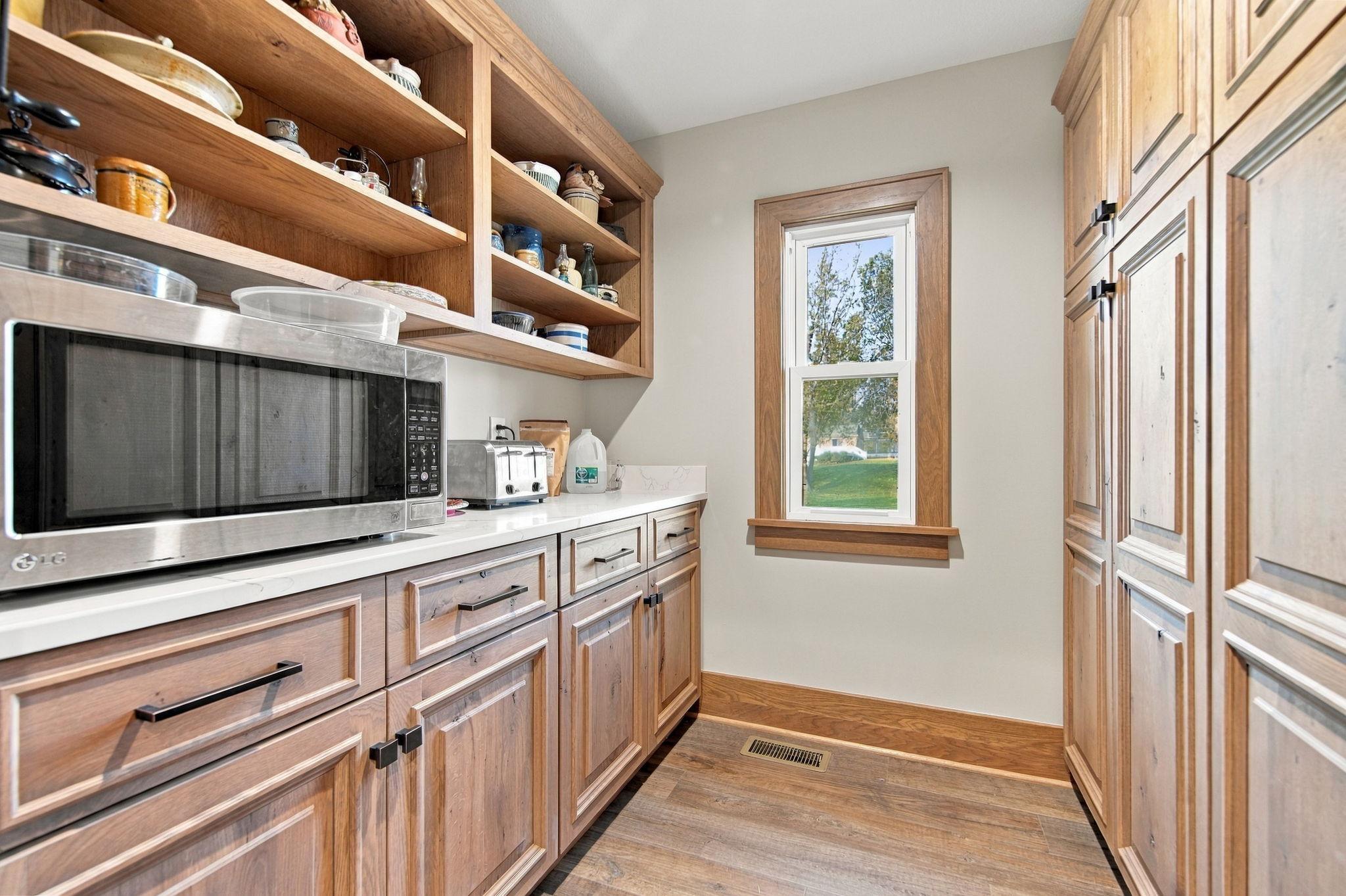 Off the kitchen is a spacious butlers panty.