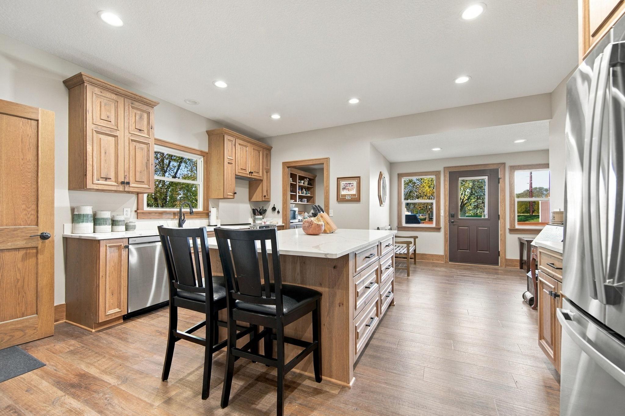 Step inside and you are greeted by the large entryway which leads you into the beautifully remodeled kitchen.