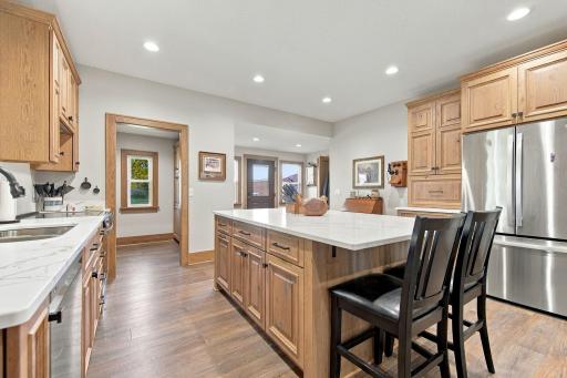Kitchen features custom cabinetry, stainless appliances, and a huge center island!