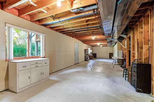 Unfinished walk-out lower level offering bright natural light and future expansion potential.