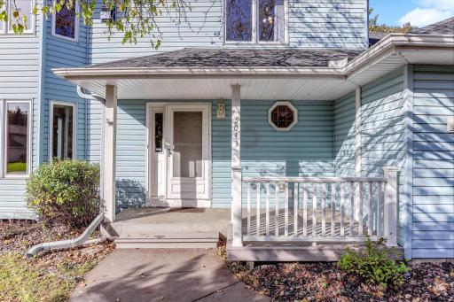 Charming front porch offering a warm, welcoming entry and a perfect spot to enjoy the outdoors.