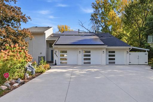 24-web-or-mls-Modern Home with Clean Driveway and Solar Panels.png