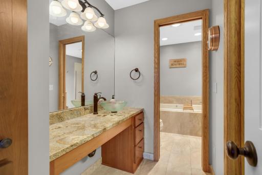 Primary en suite includes generous walk in closet & separate vanity area