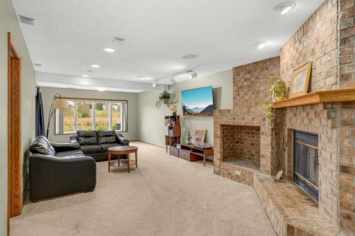 High ceilings make this basement feel very bright and spacious- wood burning stove and even more views of the water