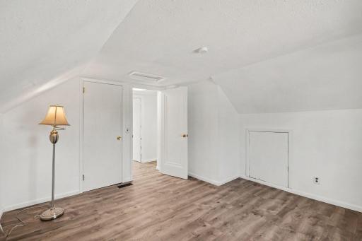 LVP FLOORING THROUGHOUT UPPER LEVEL AND CLOSET AND CONVENIENT ATTIC SPACE