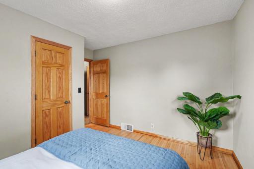 MAIN LEVEL BEDROOM WITH 'REAL' WOOD MAPLE FLOORING AND PANELED DOORS