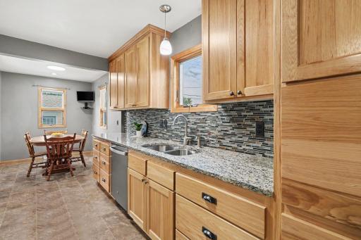 KITCHEN IS OPEN TO INFORMAL DINING AREA - ALL WITH FRESH PAINT AND NEWER LIGHTING