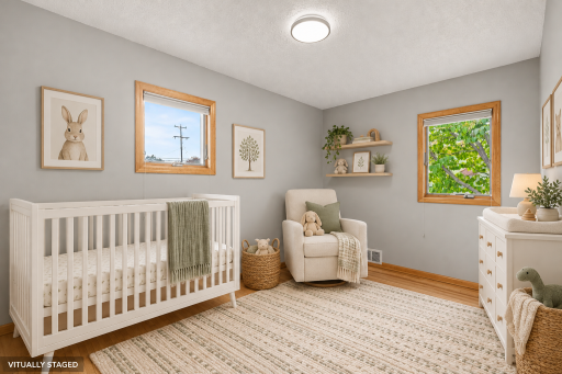 SECONDARY BEDROOM IS VIRTUALLY STAGED AS A NURSERY - 'REAL' WOOD MAPLE FLOOR AND FRESH PAINT THROUGHOUT