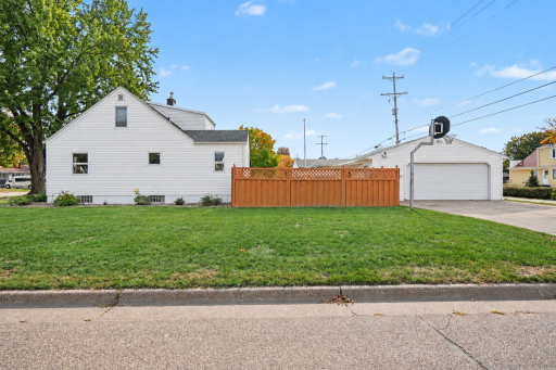 LARGE FENCED BACKYARD WITH GENEROUS SIDE YARD AND OVERSIZED TWO-CAR GARAGE WITH DIRECT ACCESS -- NO ALLEY TO WORRY ABOUT WITH THIS HOME
