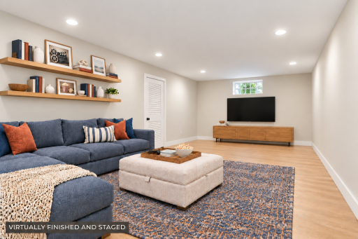 ANOTHER VIEW POINT OF THIS VIRTUALLY FINISHED AND STAGED FAMILY ROOM WITH STORAGE ROOM BEHIND THE DOOR