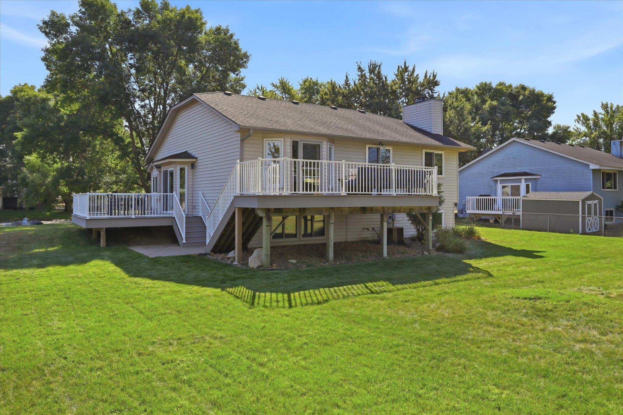 Enjoy expanded outdoor living space with two decks updated with low-maintenance Azek decking in 2020.