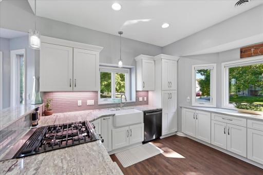 A beautiful farmhouse sink adds charm and function to the remodeled kitchen.