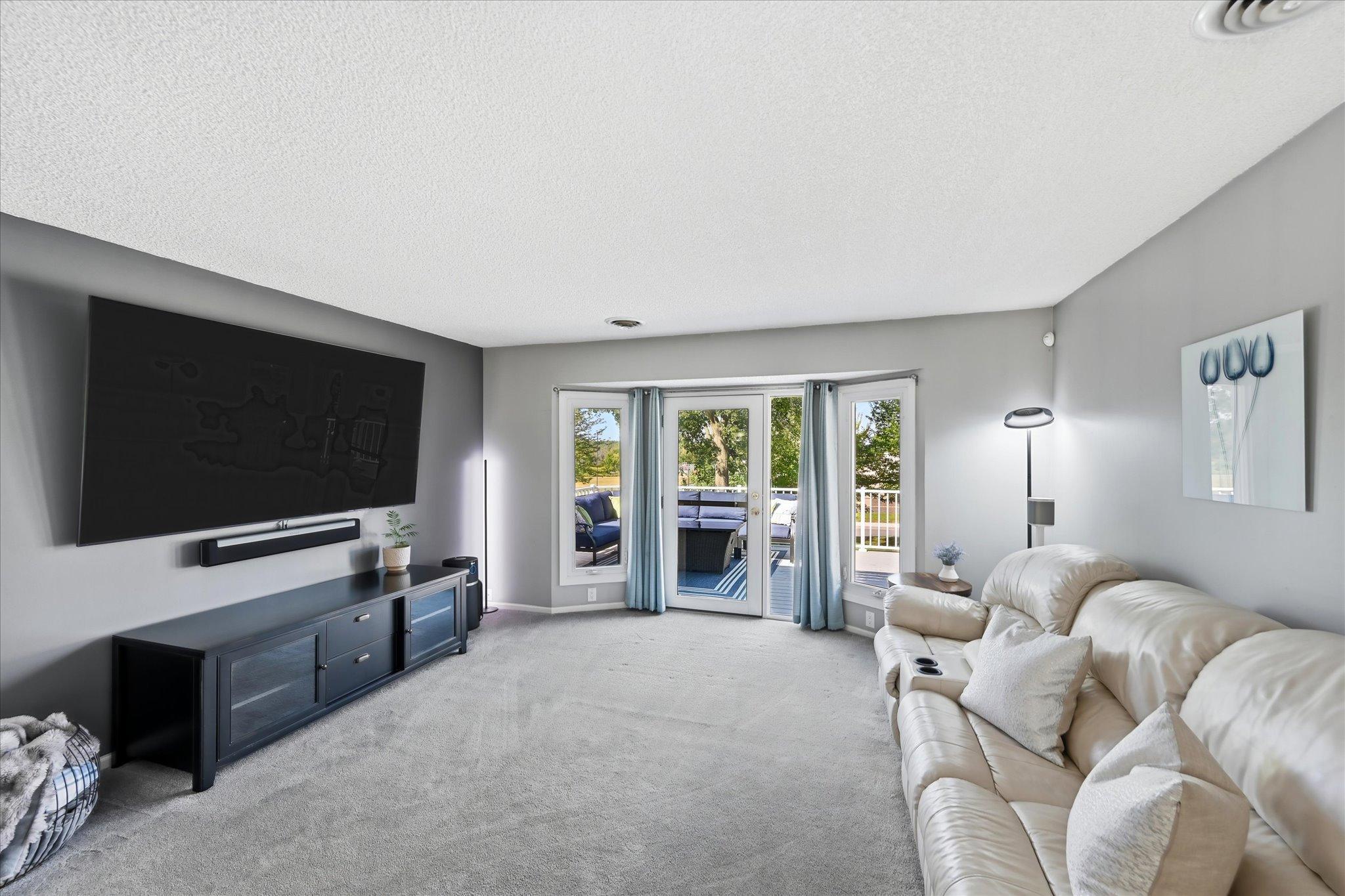 A comfortable gathering space filled with natural light and easy access to the second deck.