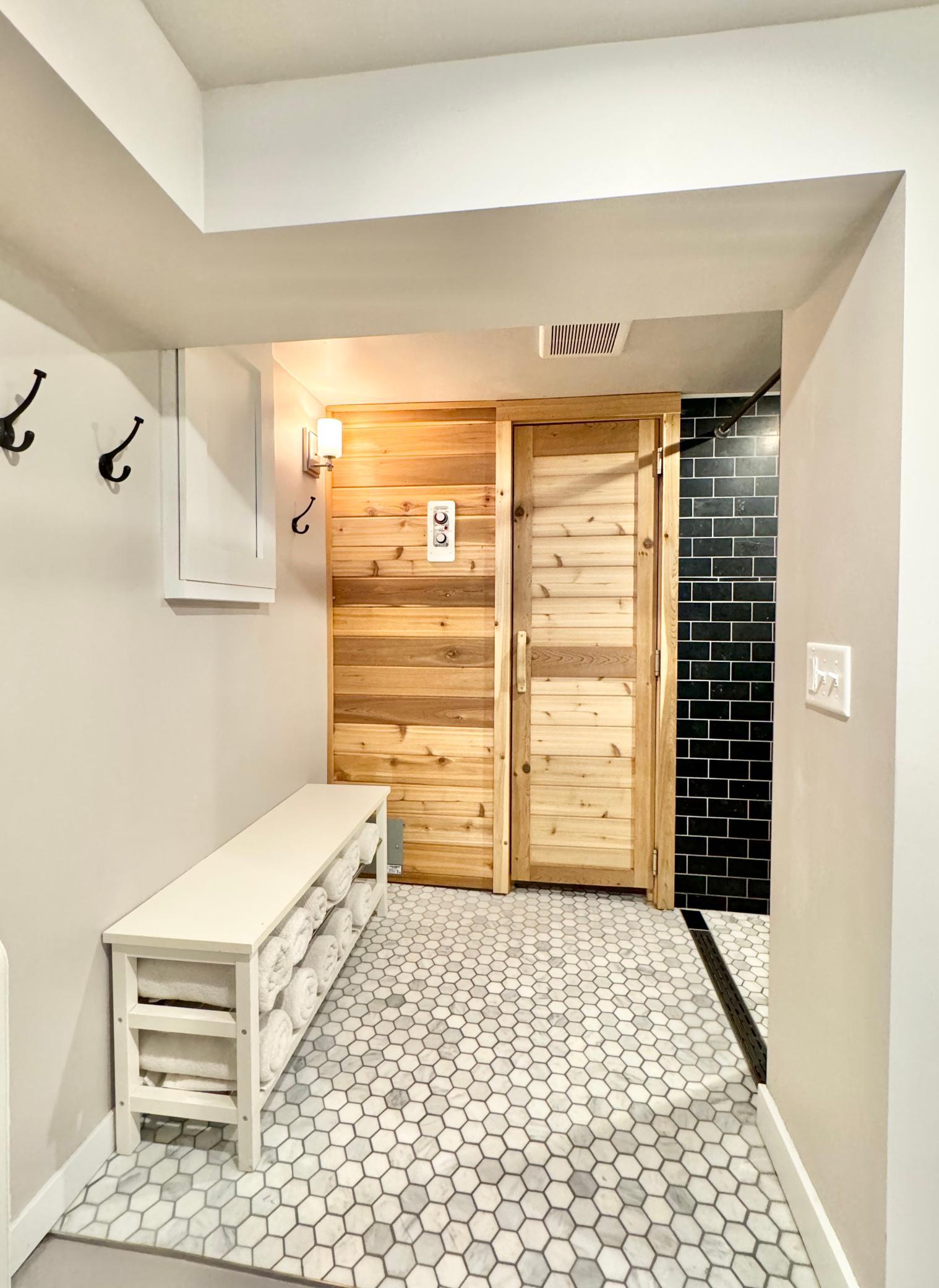 Sauna with gorgeous connected shower.