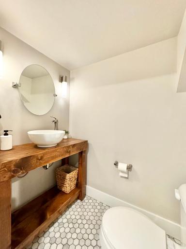 Lover level bathroom features marble flooring.