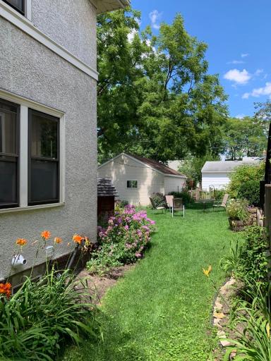 Yard view has lots of beautiful perennial plants.